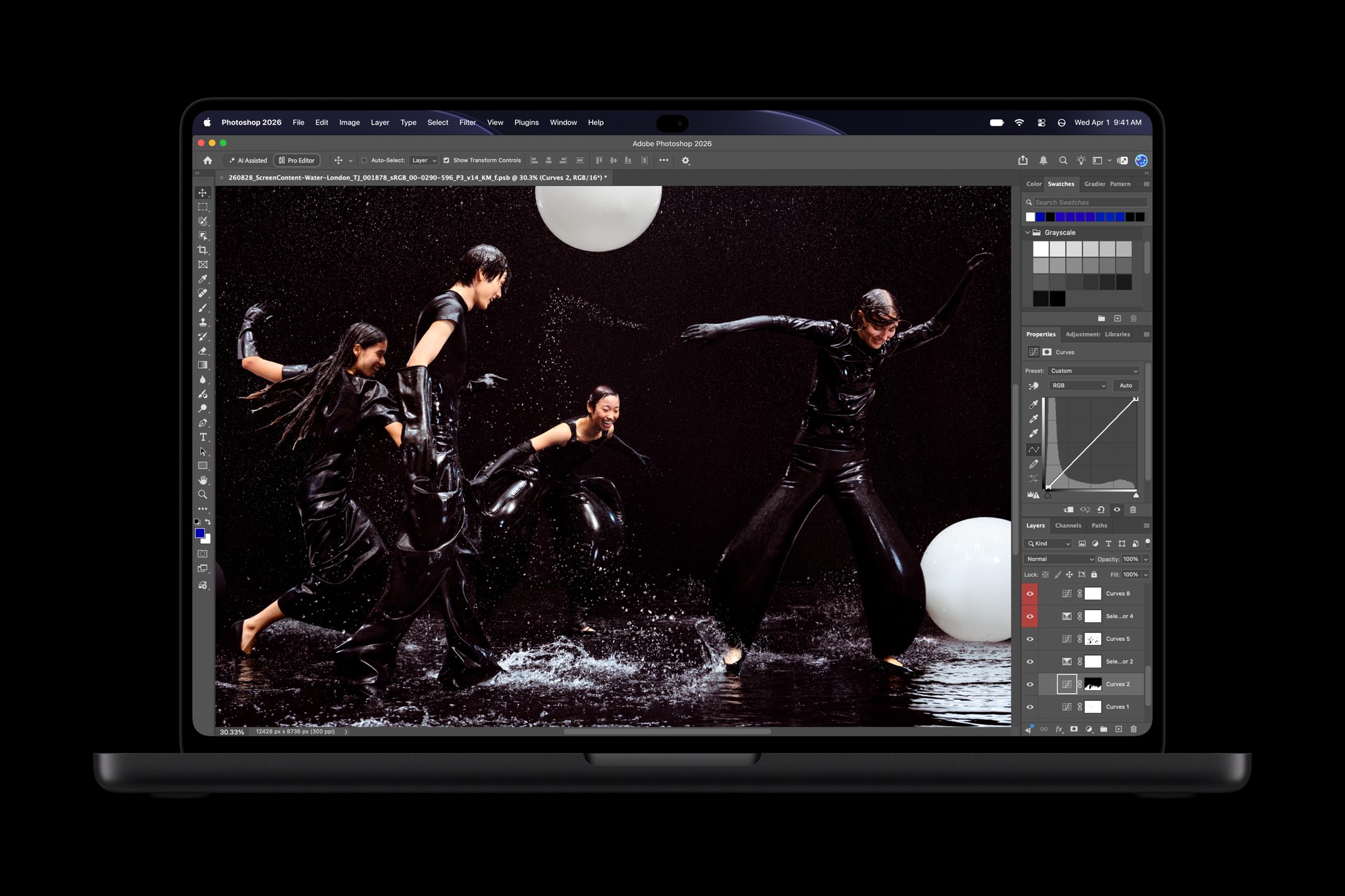 An open MacBook Pro with PROLED XDR Display shows the Photoshop app.