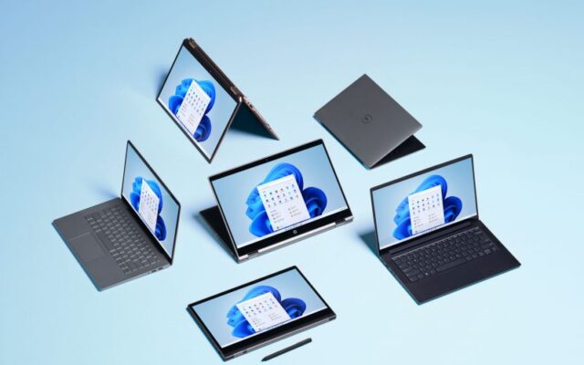 Photo of laptop and tablet devices with Windows 11 desktop rendered on screens