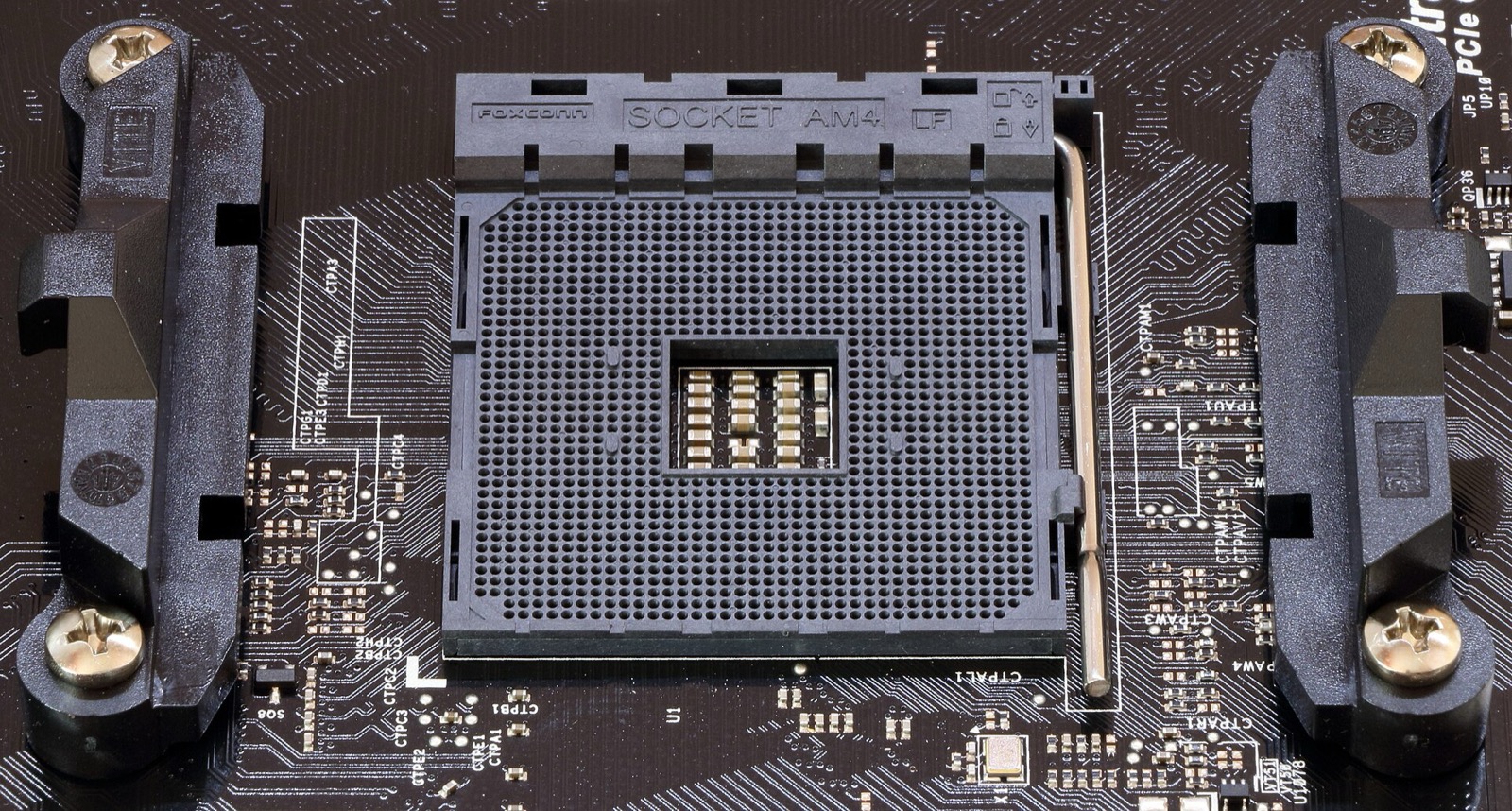 An empty AMD AM4 socket on a motherboard