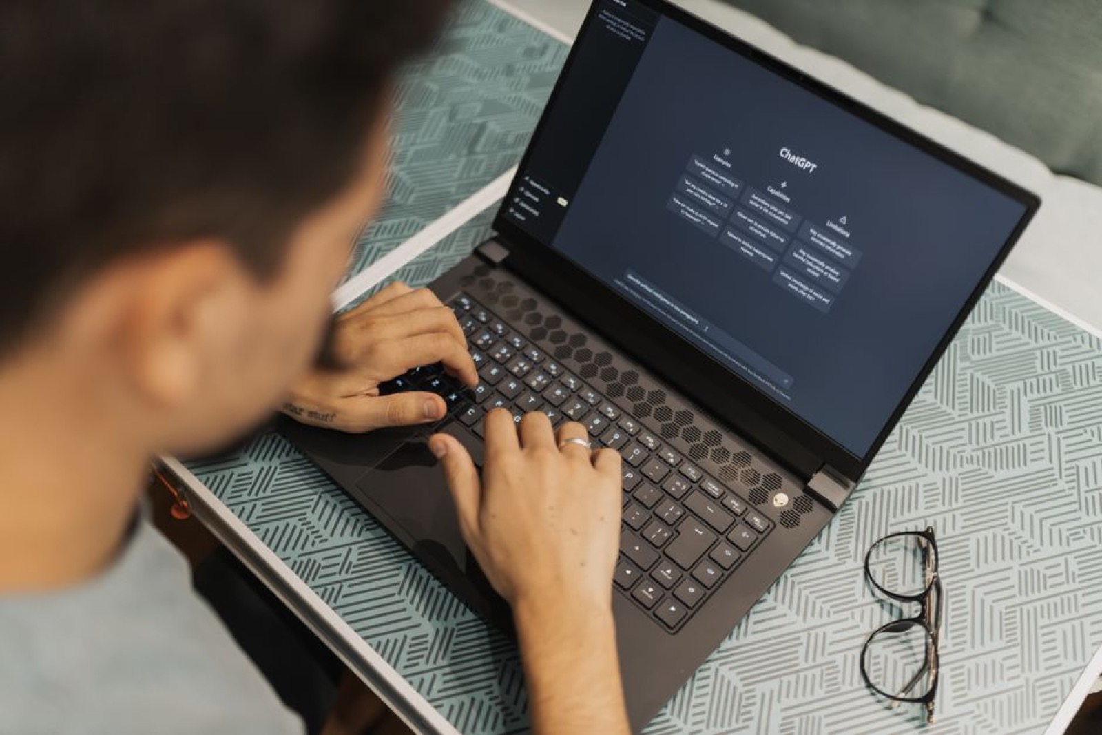 A man working on a laptop with AI software