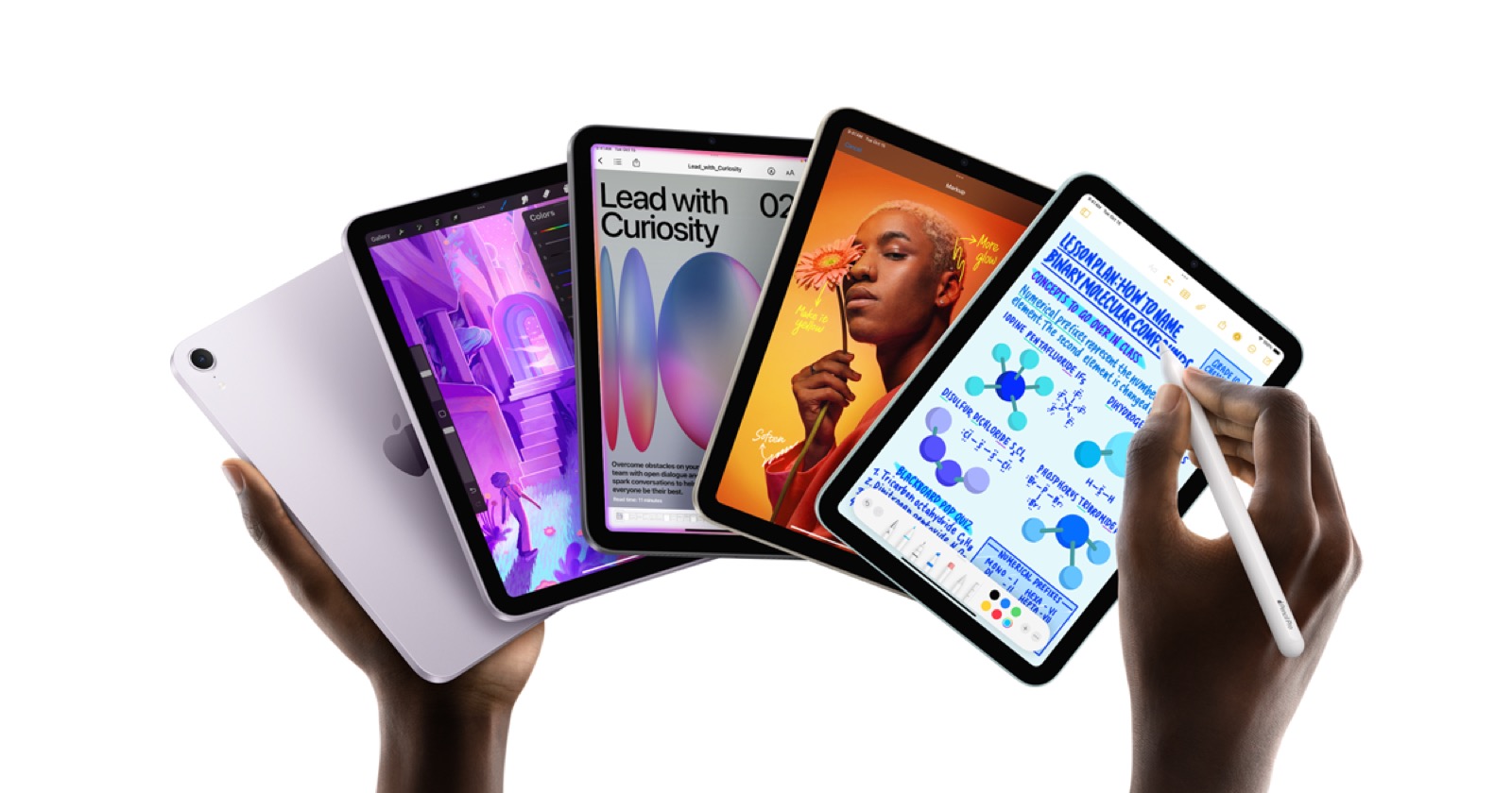 The current iPad mini held in two hands with Apple Pencil