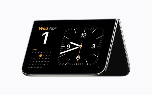 iPhone Duo folded and propped up horizontally in StandBy, showing a clock and calendar