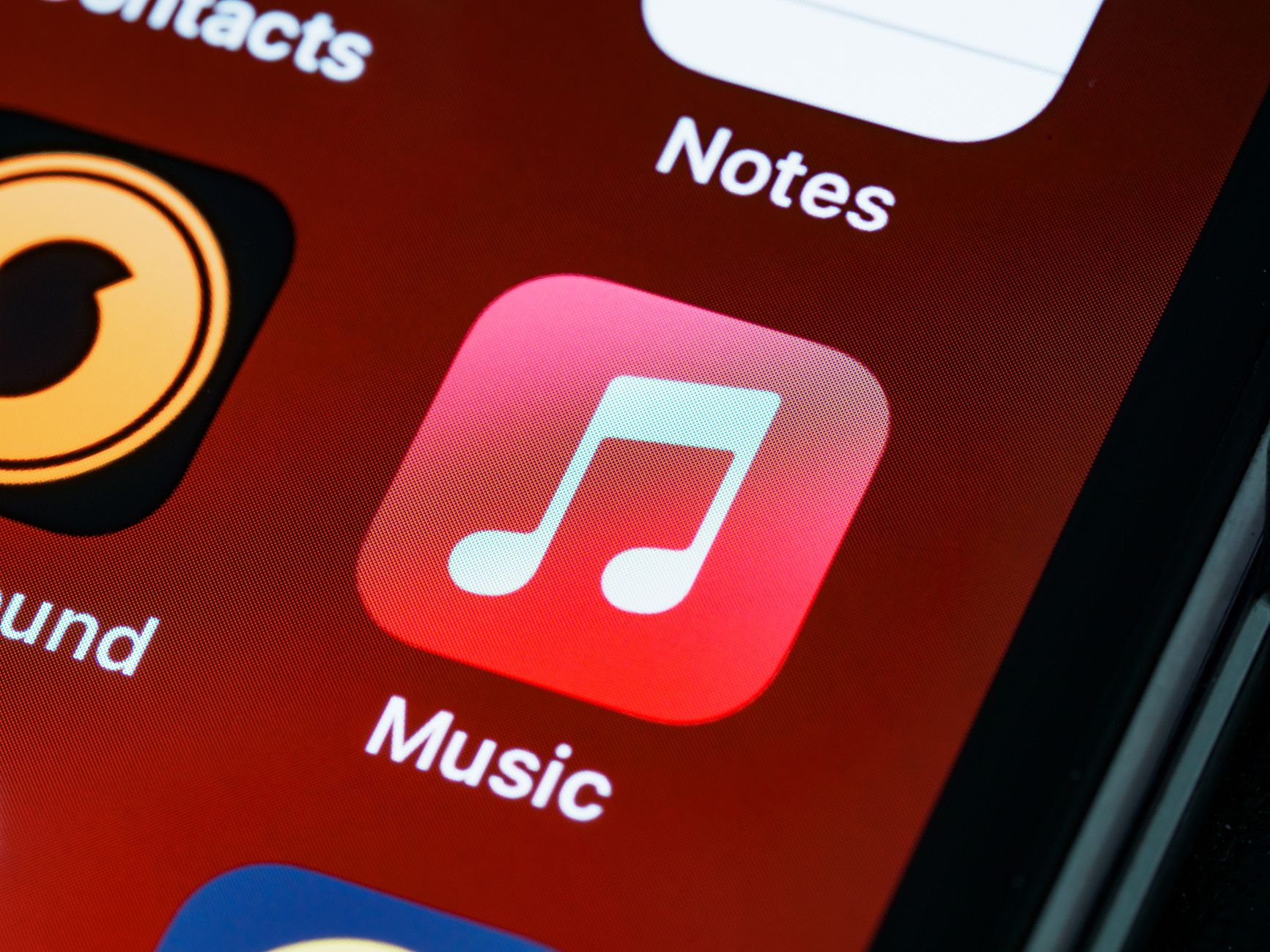 The current red Apple Music app icon on an iPhone home screen