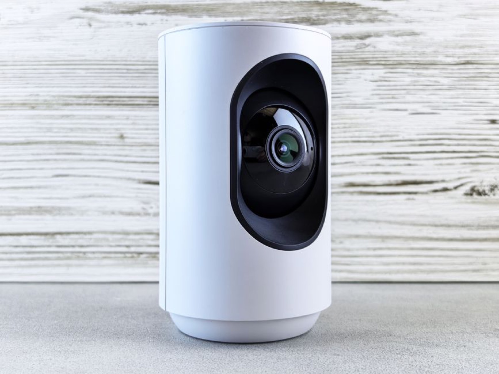A white indoor home security camera