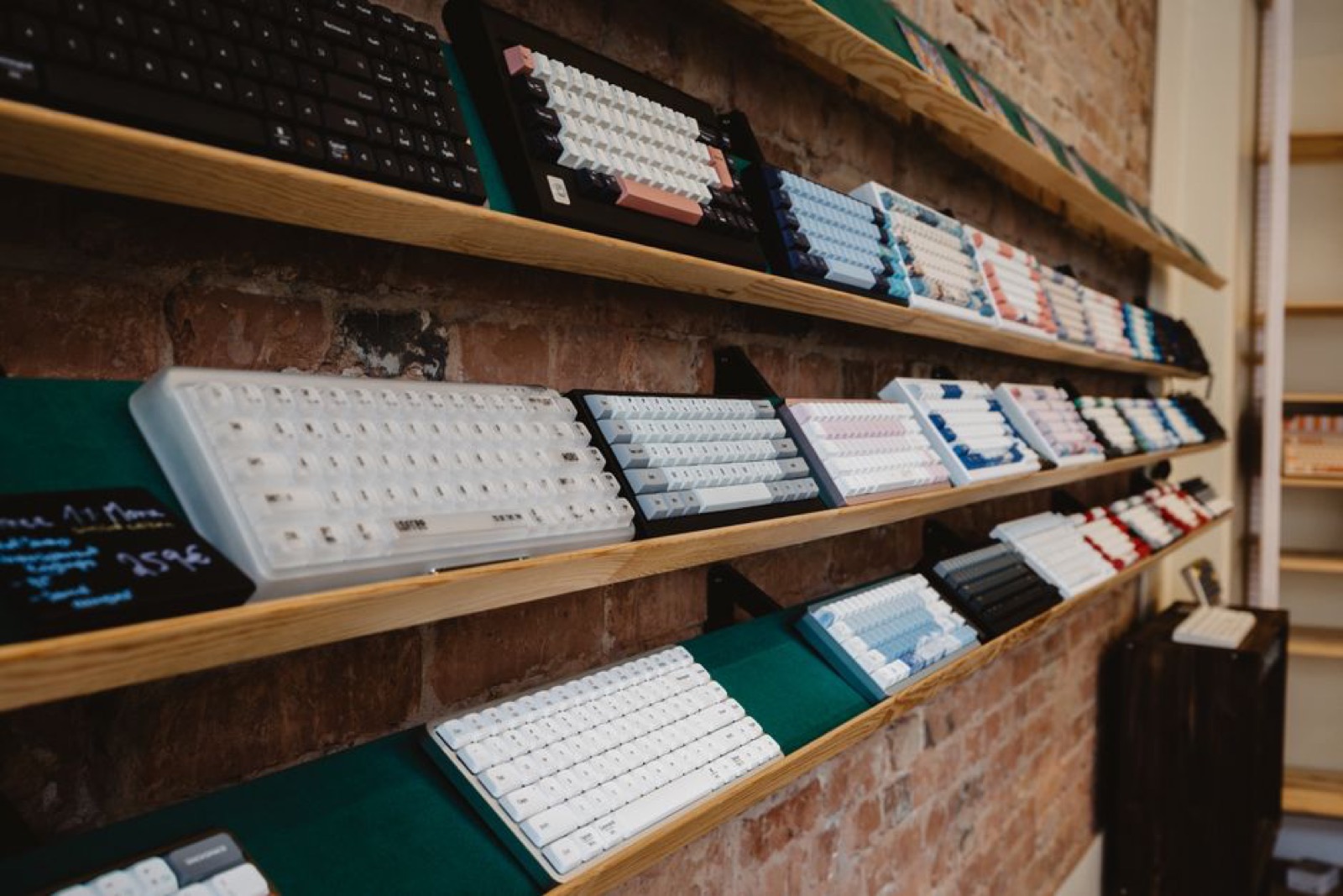 A variety of mechanical keyboards on a shelf