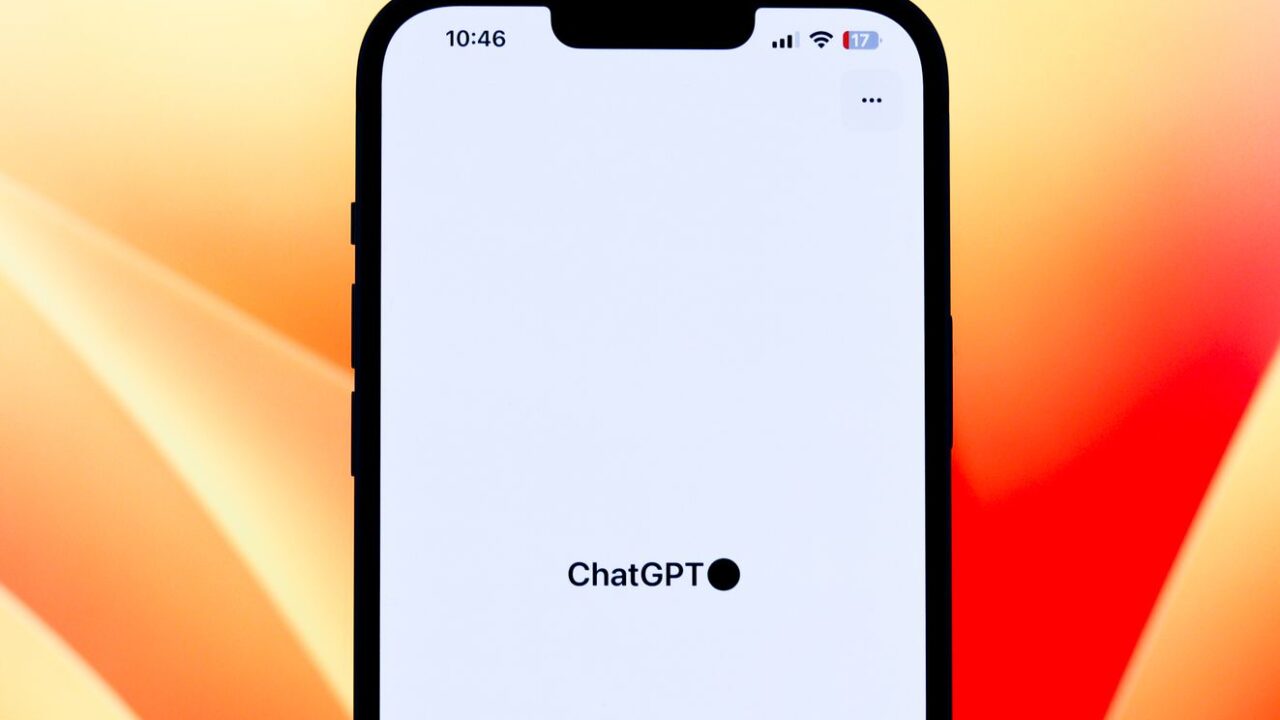 A smartphone showing the ChatGPT app against a colorful background