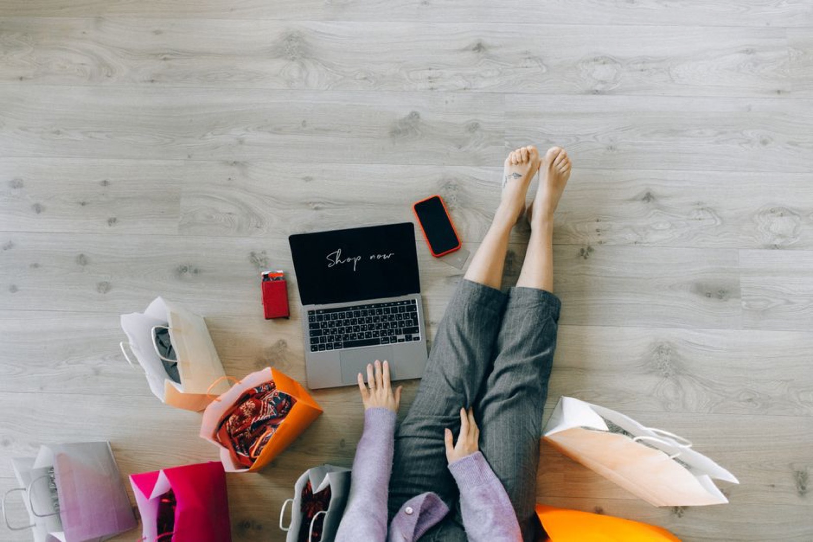 A woman shopping online on a laptop