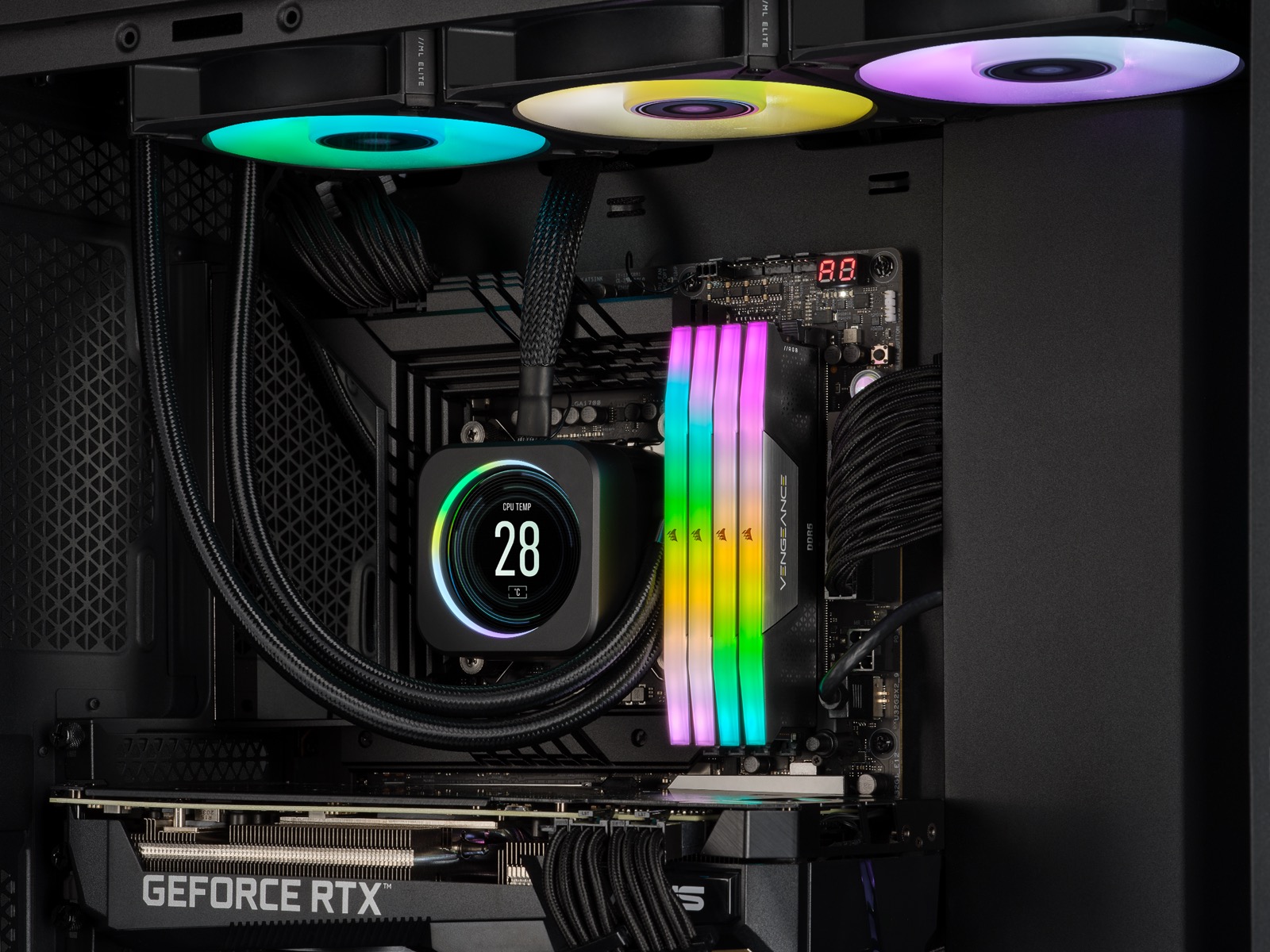 Four Corsair Vengeance RGB DDR5 memory modules installed on a motherboard