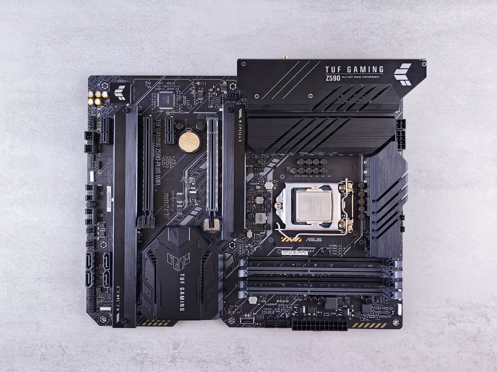 A desktop motherboard with an Intel processor installed in its socket