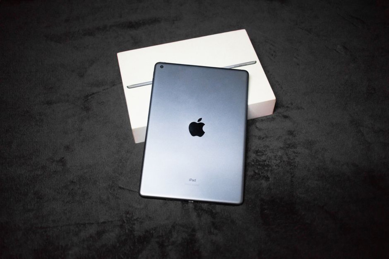 An iPad on top of its box