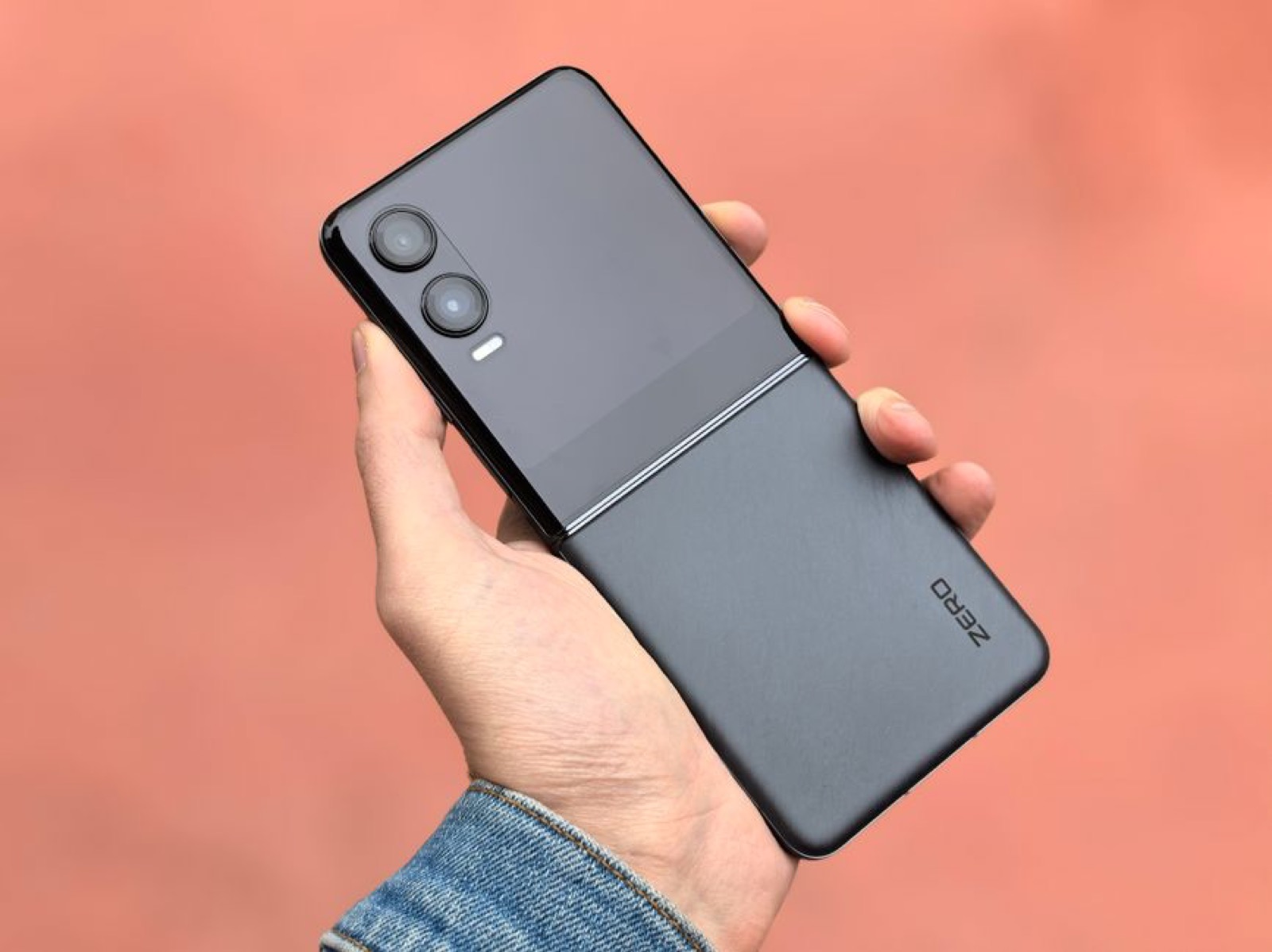 A hand holding a modern foldable phone
