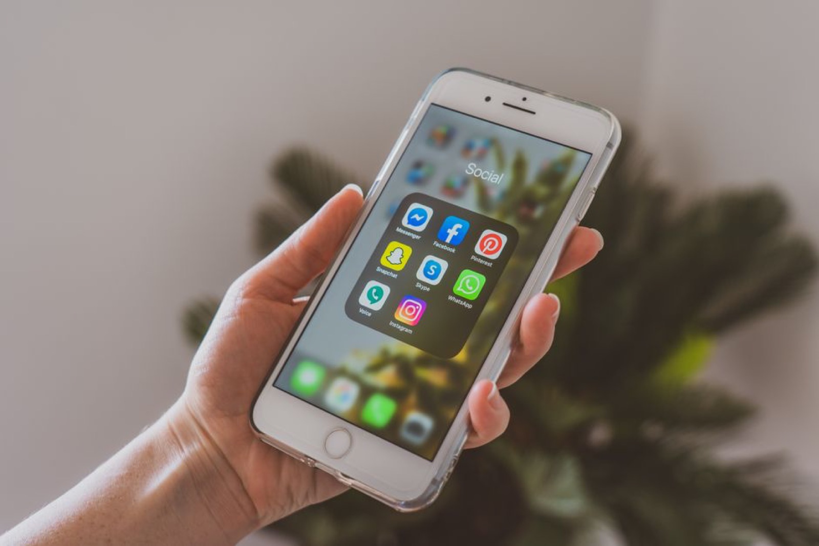 A hand holding a smartphone