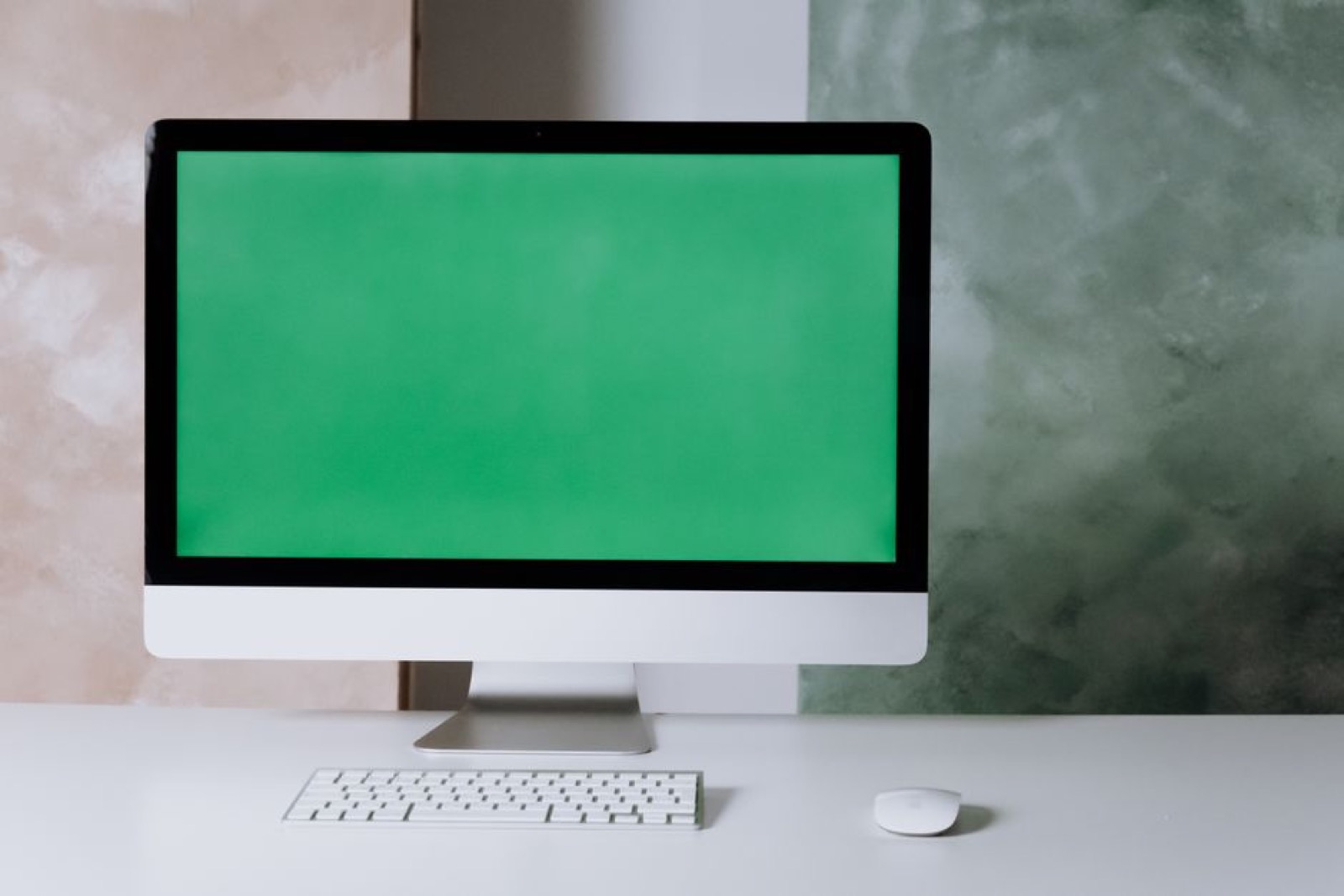 A clean, minimalist desk with a computer