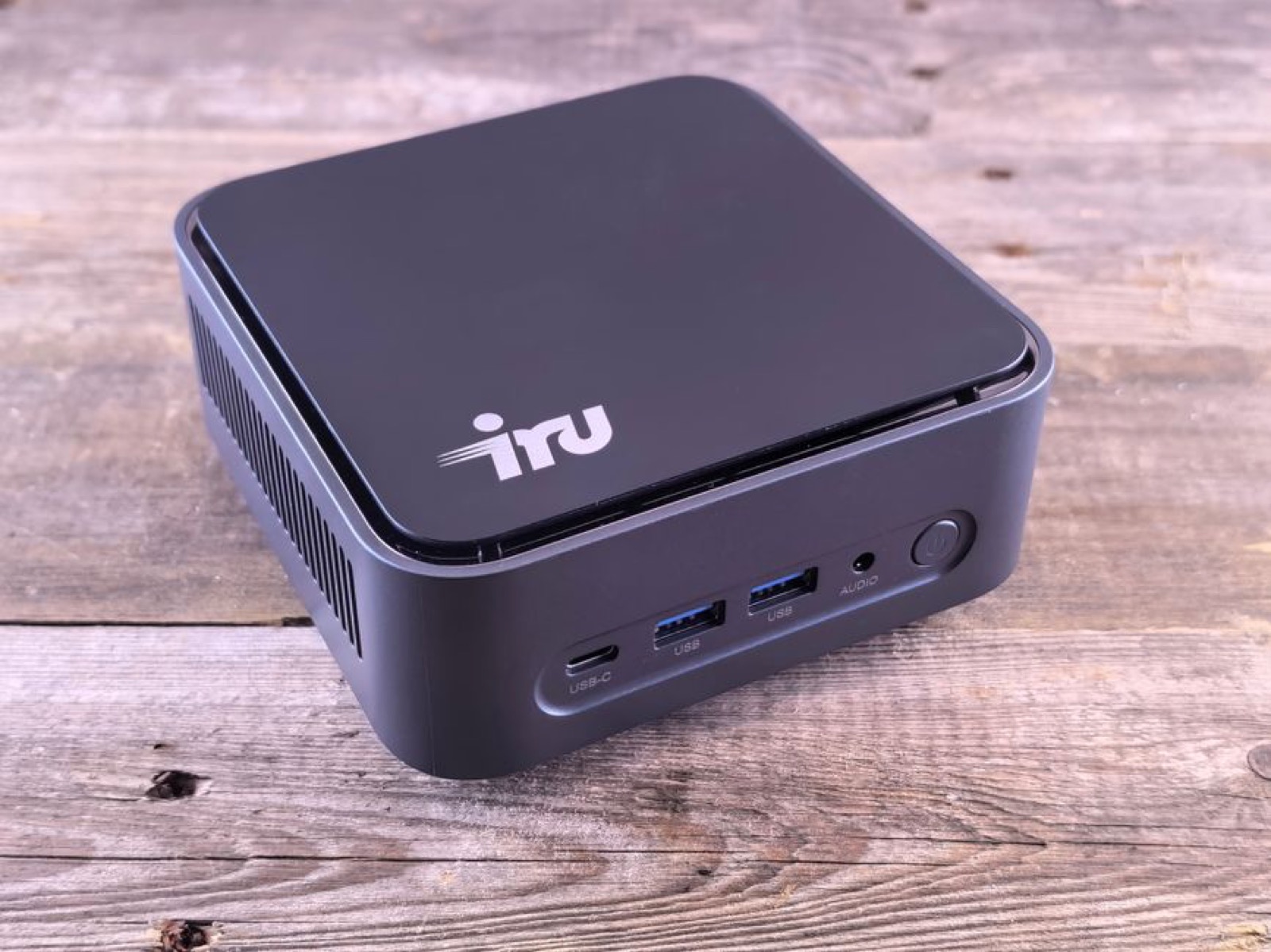 A small, sleek mini desktop computer