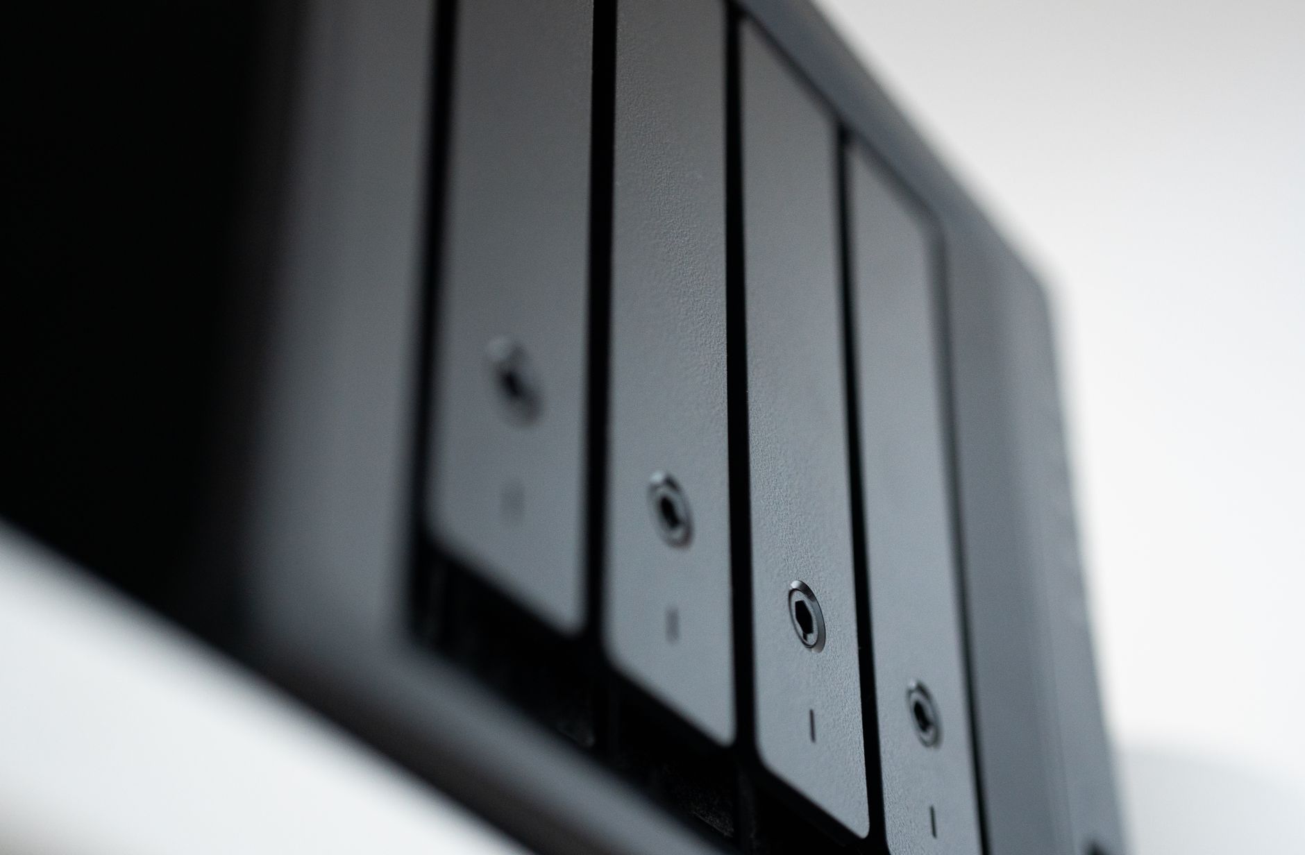 Drive bays on a home NAS, the kind of box many people run Plex on