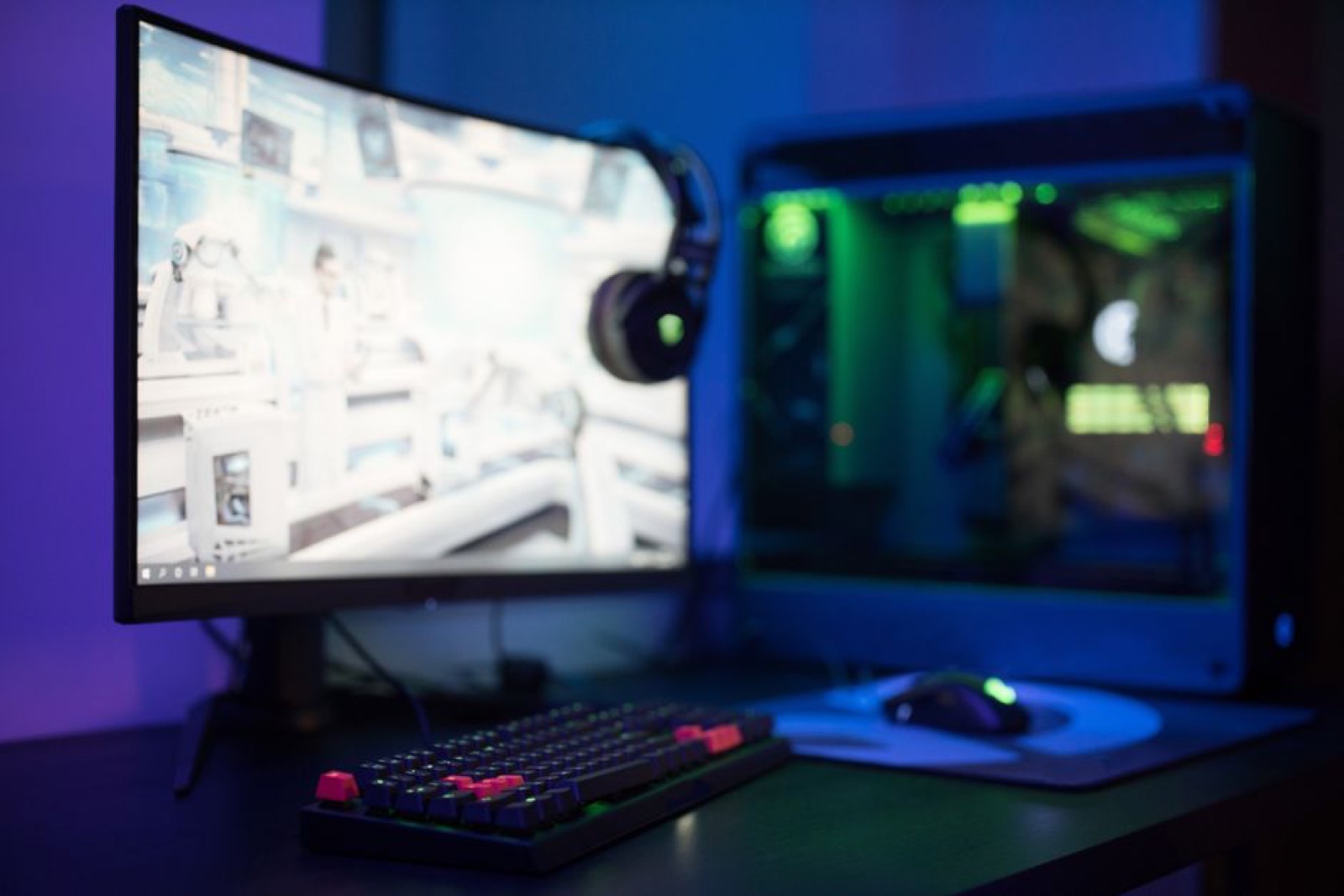 A PC gaming setup with a curved monitor