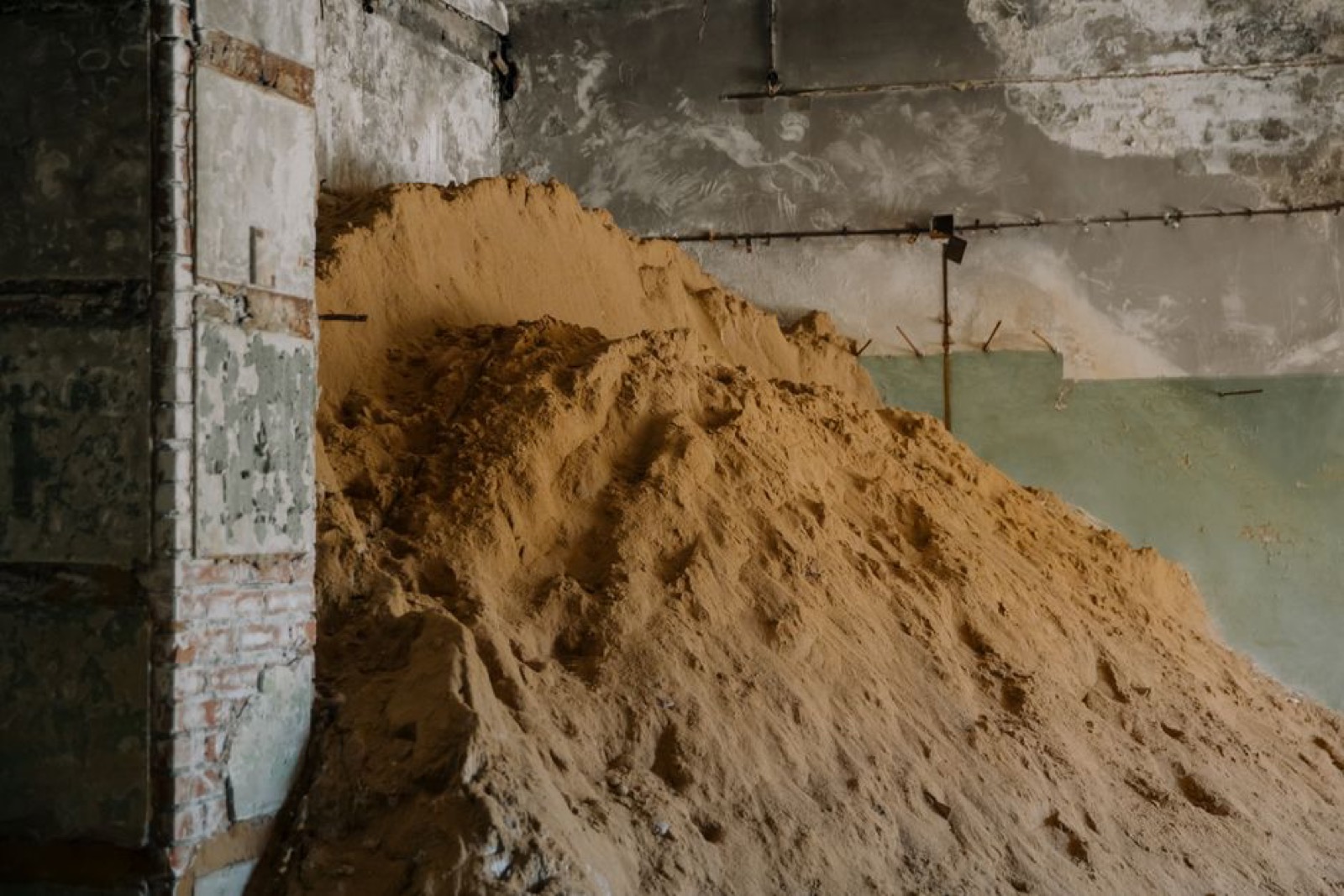A large pile of sand inside a building