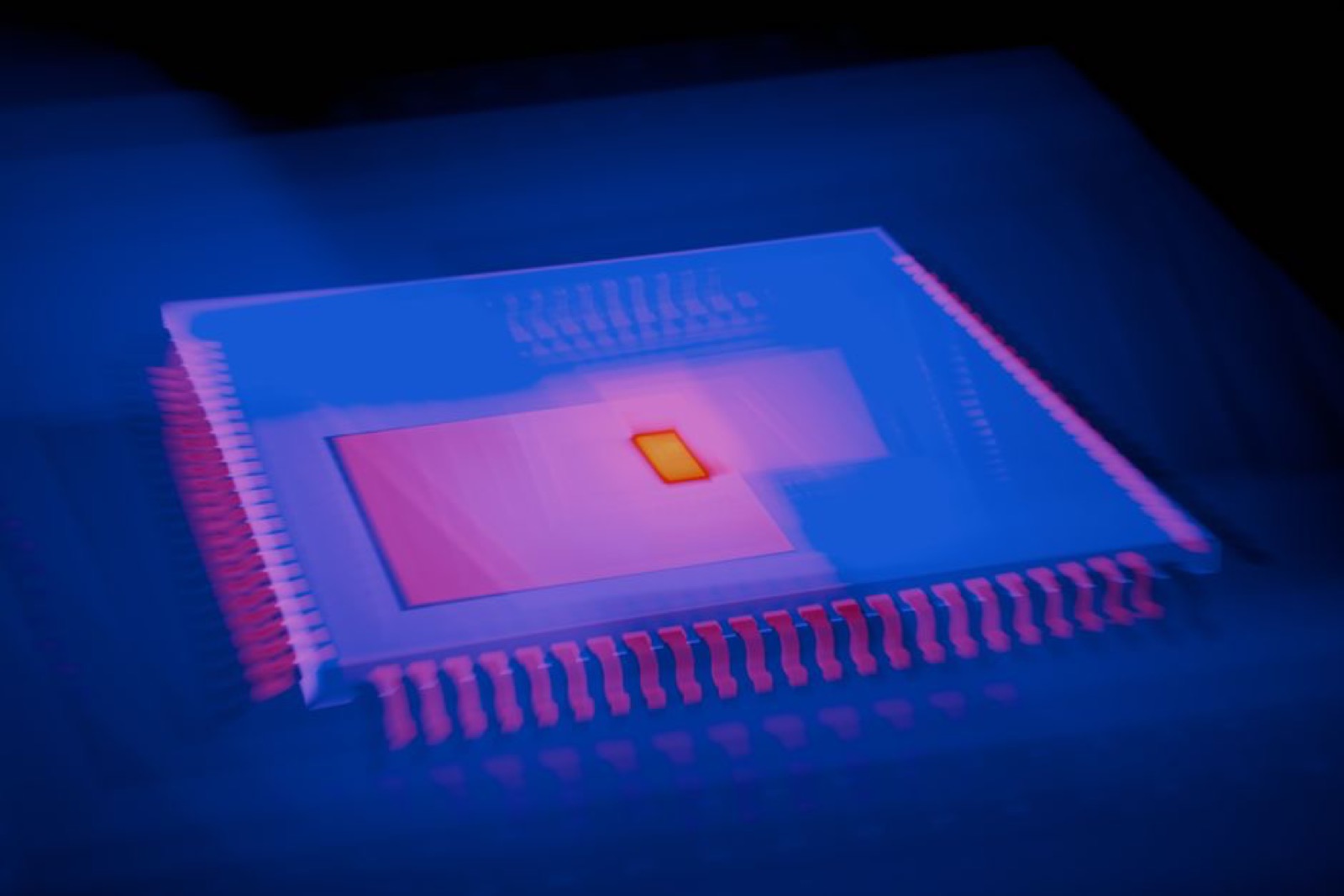 Close-up of a glowing microchip