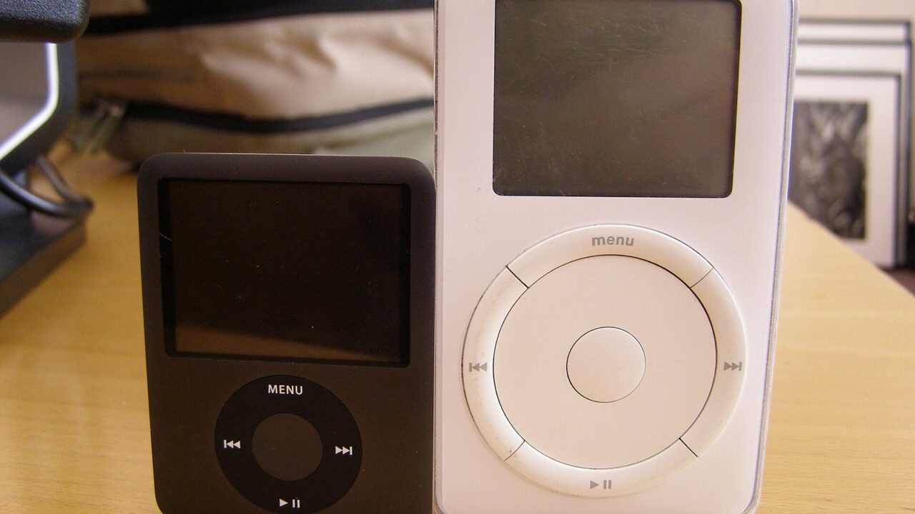 The original 5GB iPod next to a later iPod nano