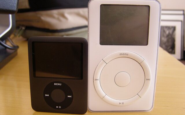 The original 5GB iPod next to a later iPod nano