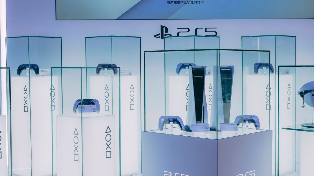 PlayStation 5 consoles and controllers on display in a store