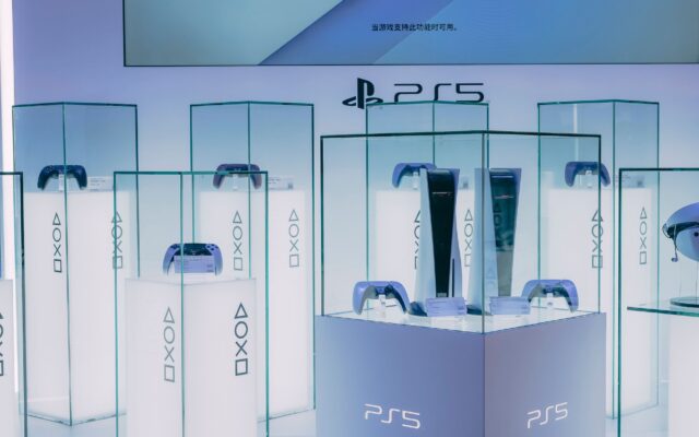 PlayStation 5 consoles and controllers on display in a store