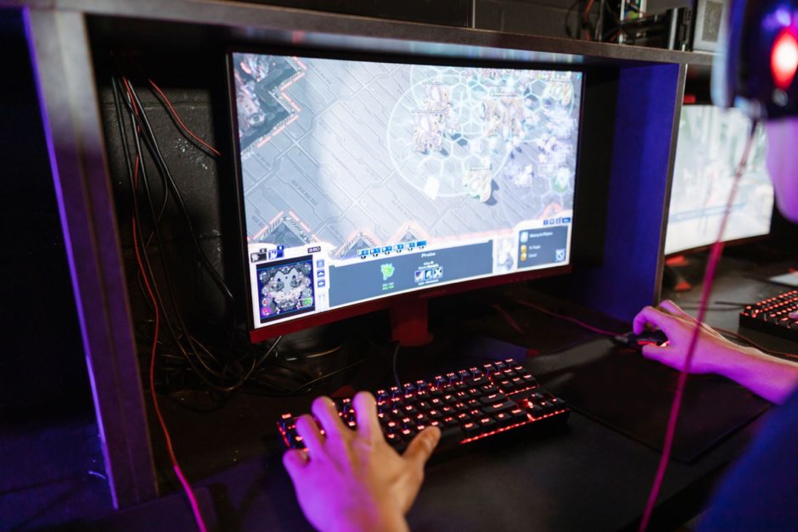 A gamer playing an online game on a PC