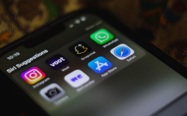 Detailed view of a smartphone home screen displaying various social media and utility apps.