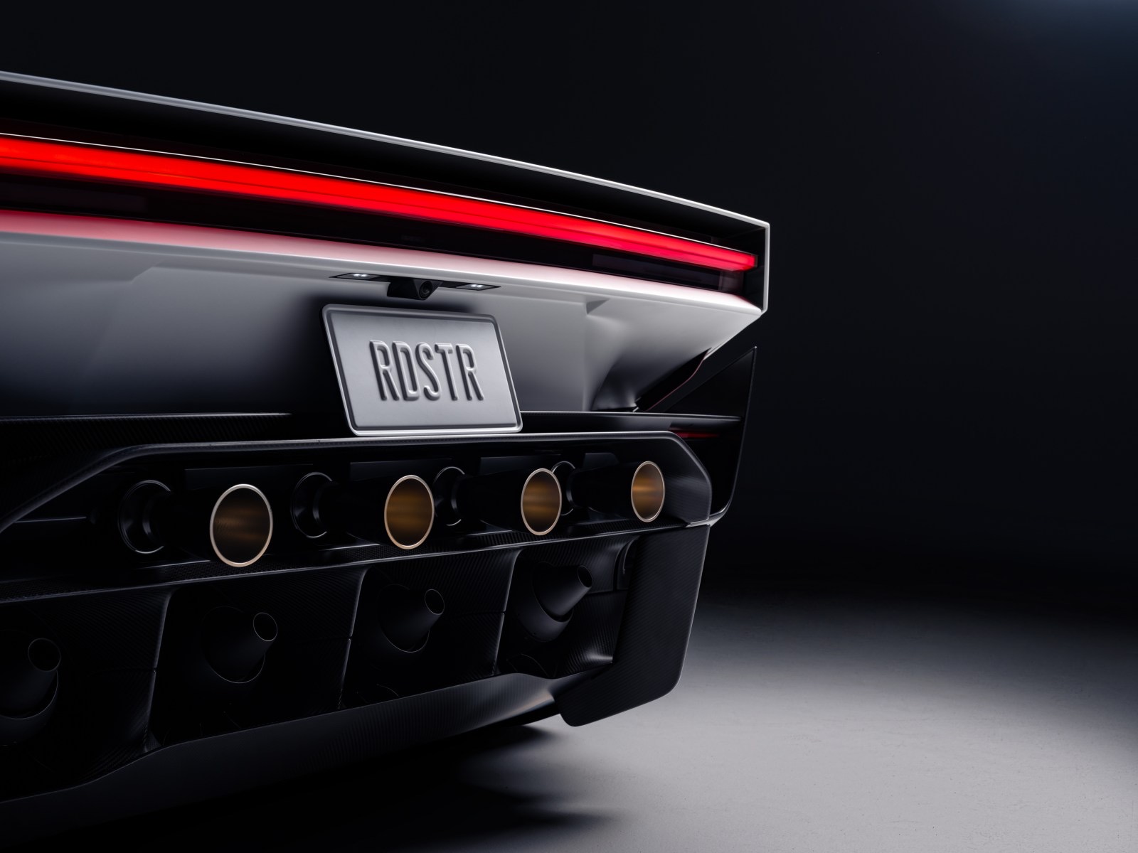 The rear of the new Tesla Roadster, showing its thruster outlets and light bar