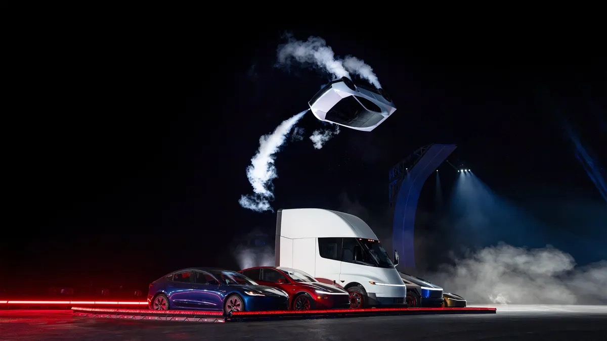 The new Tesla Roadster flying over a Tesla Semi and other cars on its thrusters at the October 15 presentation