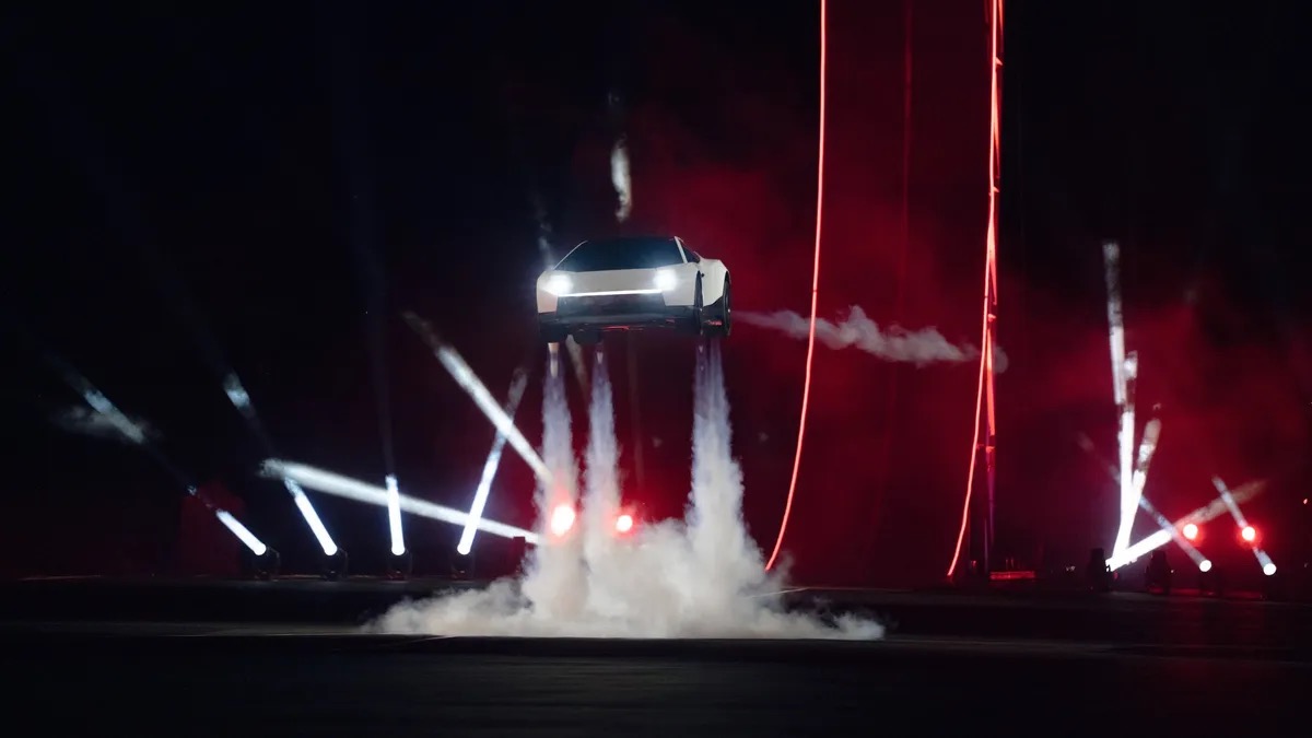 The new Tesla Roadster landing with its thrusters firing during the presentation