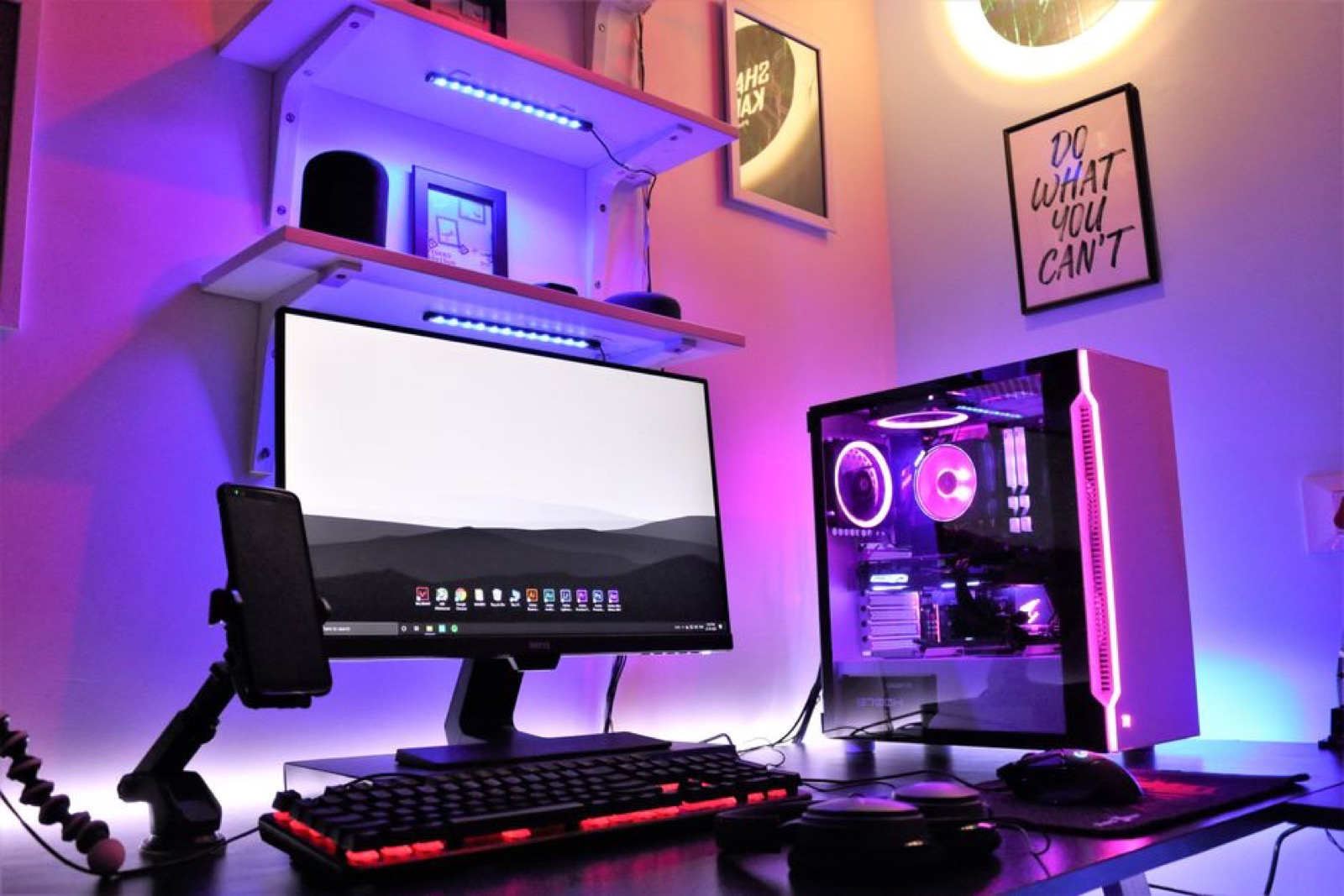 A gaming desk setup with RGB lighting