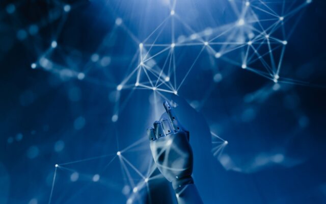 A robotic hand reaching into a digital network on a blue background, symbolizing AI technology.